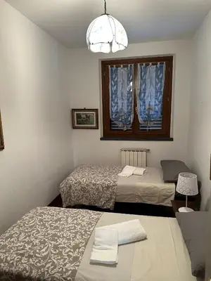 Letto o letti in una camera di Casa Maria (posto auto gratuito)