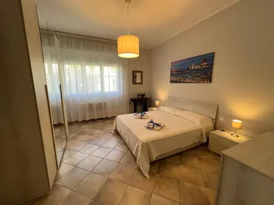 Letto o letti in una camera di La finestra sul giardino