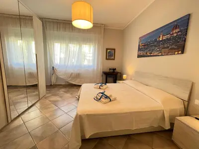 Letto o letti in una camera di La finestra sul giardino