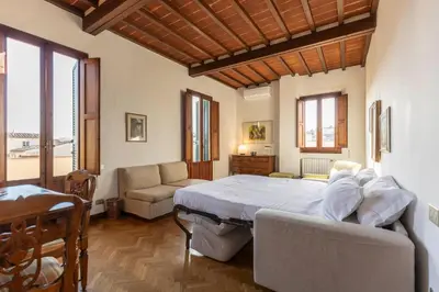 Letto o letti in una camera di Palazzo Cecchi Florentine Apartment