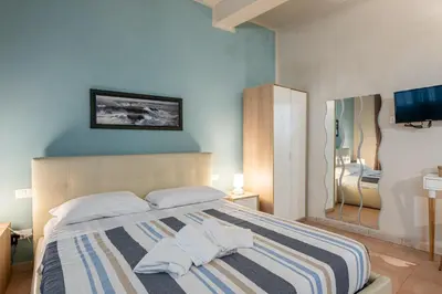 Letto o letti in una camera di GuestHost - Porta Romana & Boboli Suite