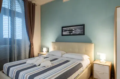 Letto o letti in una camera di GuestHost - Porta Romana & Boboli Suite