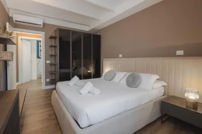 Letto o letti in una camera di San Marco - FillYourHomeWithLove Design Apartment
