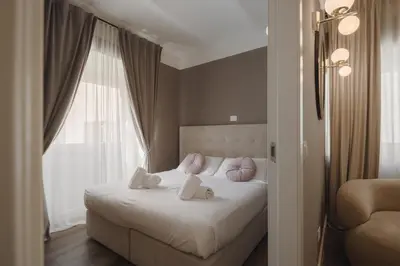 Letto o letti in una camera di San Marco - FillYourHomeWithLove Design Apartment