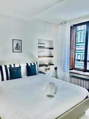 Letto o letti in una camera di La Mandorla Iconic Duomo View