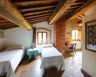 Letto o letti in una camera di Molino in chianti