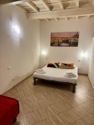 Letto o letti in una camera di Lovely portion of property few steps from Basilica Santa Croce