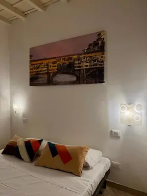 Letto o letti in una camera di Lovely portion of property few steps from Basilica Santa Croce