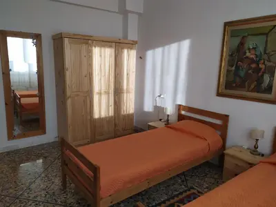 Letto o letti in una camera di Grande casa vicina al centro