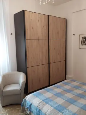 Letto o letti in una camera di Grande casa vicina al centro