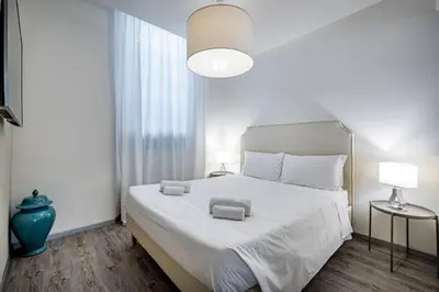 Letto o letti in una camera di Garibaldi Luxury apartments