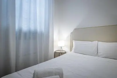 Letto o letti in una camera di Garibaldi Luxury apartments
