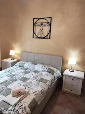 Letto o letti in una camera di Casa Raffaello Careggi