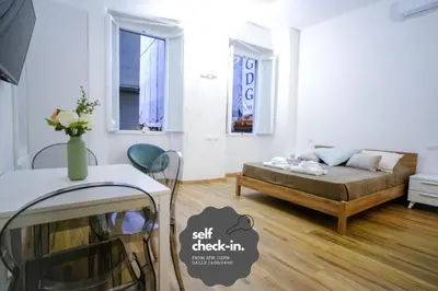 Letto o letti in una camera di Le Dantesche Boutique Apartments