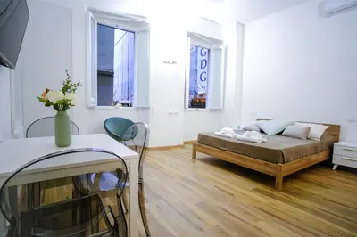 Letto o letti in una camera di Le Dantesche Boutique Apartments