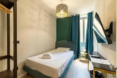 Letto o letti in una camera di Room Eleven