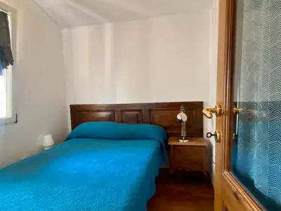 Letto o letti in una camera di Il giardino sospeso di Anna