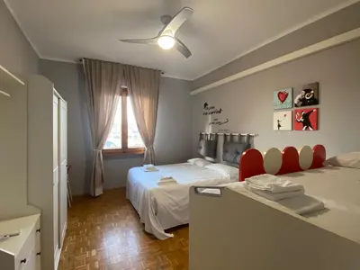 Letto o letti in una camera di Camilla Florence Apartment