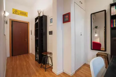 Area soggiorno di Cozy Apartment In Borgo Dei Greci Firenze