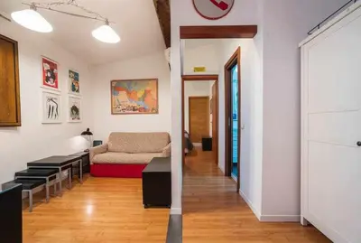 Area soggiorno di Cozy Apartment In Borgo Dei Greci Firenze