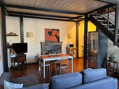Area soggiorno di Nice and quiet loft 5 minutes walk from the Duomo
