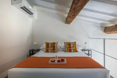 Letto o letti in una camera di Santo Spirito's Nest