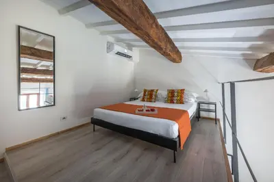 Letto o letti in una camera di Santo Spirito's Nest