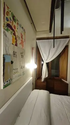 Letto o letti in una camera di Appartamento Torre della Buca