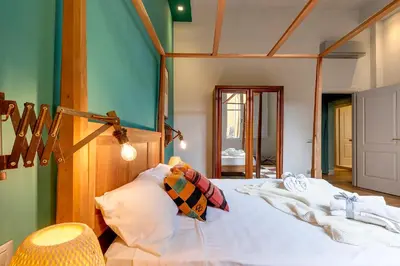 Letto o letti in una camera di Frida Luxury Apartment by Mamo Florence