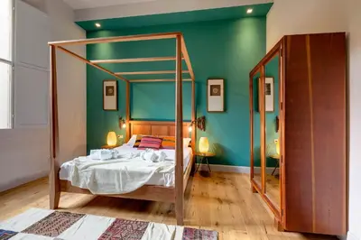 Letto o letti in una camera di Frida Luxury Apartment by Mamo Florence