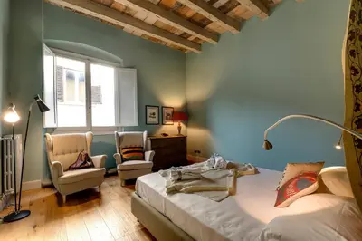 Letto o letti in una camera di Frida Luxury Apartment by Mamo Florence