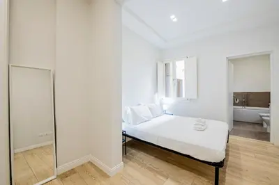 Letto o letti in una camera di Domus San Frediano - Double Suite con Jacuzzi by Hôtea