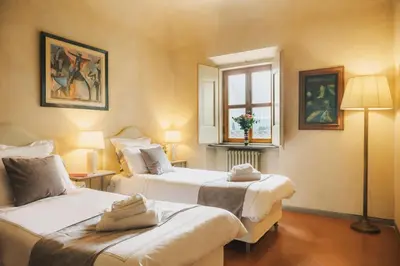 Letto o letti in una camera di Apartments Florence - Villa La Medicea with swimming pool