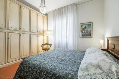 Letto o letti in una camera di CASA ADRIANA Elegante e luminosa