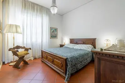 Letto o letti in una camera di CASA ADRIANA Elegante e luminosa