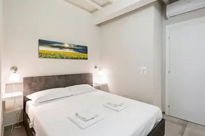 Letto o letti in una camera di La Loggia della Signoria Charming Loft