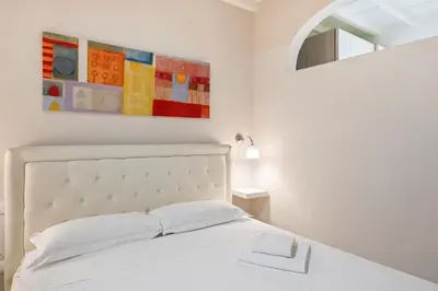 Letto o letti in una camera di Il Palazzo della Signoria Modern Loft