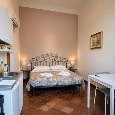 Letto o letti in una camera di Loft Ortensia garden WiFi air conditioning