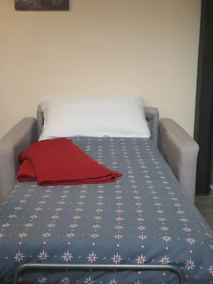 Letto o letti in una camera di Due Strade Loft Firenze