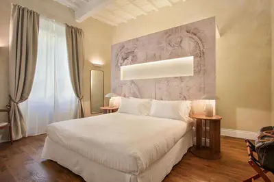 Letto o letti in una camera di Seggiole Boutique Apartment Iris