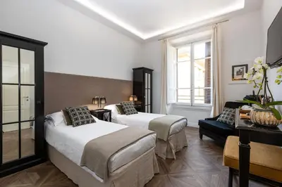 Letto o letti in una camera di RFC Repubblica Florence Core B&B