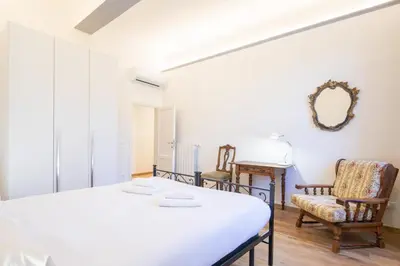 Letto o letti in una camera di Petrarca Apartment