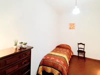 Letto o letti in una camera di Casa Chianti