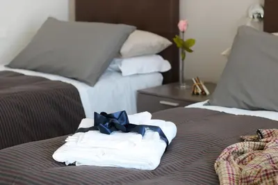 Letto o letti in una camera di PIUMABLU