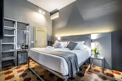 Letto o letti in una camera di Mama's Home Florence