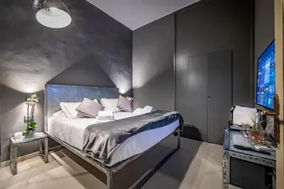 Letto o letti in una camera di Mama's Home Florence