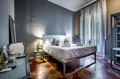 Letto o letti in una camera di Mama's Home Florence