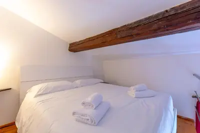 Letto o letti in una camera di Toscanella Suite Florence