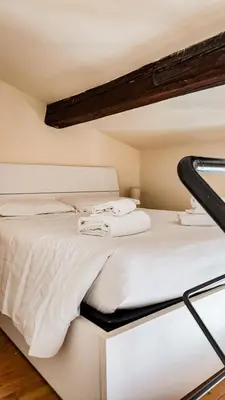 Letto o letti in una camera di Toscanella Suite Florence