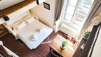 Letto o letti in una camera di Toscanella Suite Florence